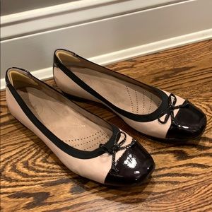 Nude and black Clarks flats